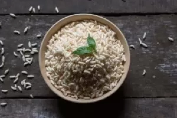 Puffed rice or muri in a heap in a bowl. Top view, selective focus.