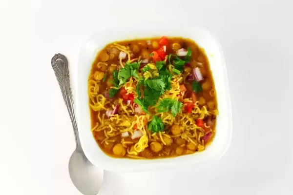 traditional indian gujarati food bhel snack or chaat sev usal or misal made from dried green peas besan vermicelli and spices