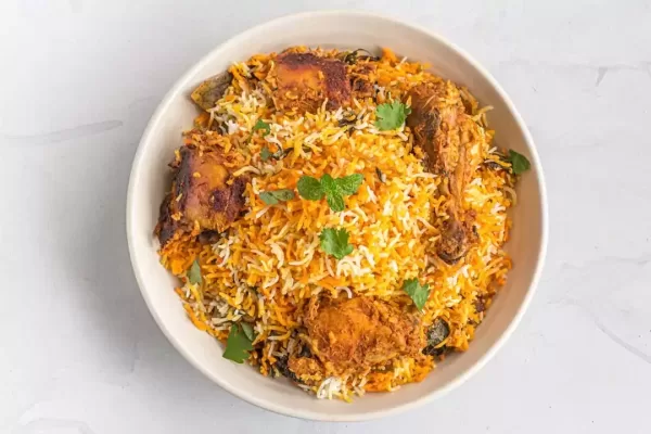 Chicken Dum Biryani in a Pot on White Background Top View Photo.