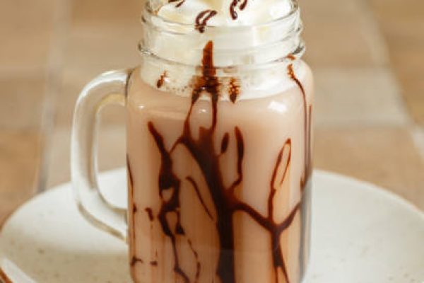 Nutella Chocolate Milkshake with whipped cream in mason jar